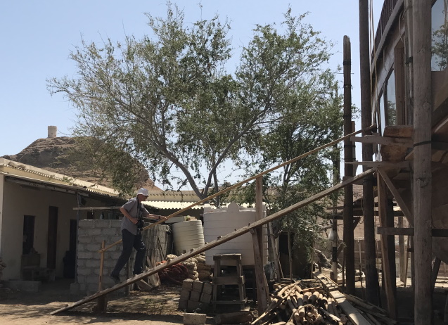 Walking the plank into a dhow in factory