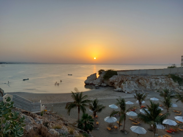 Sunset and Crowne Plaza beach